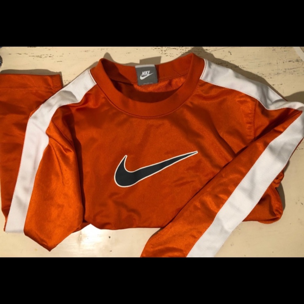 Long sleeved orange Nike workout shirt, size M (10-12)